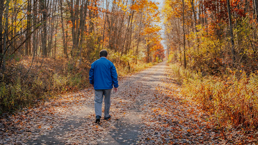 Paul Griffith walks paved trail in Mecosta County