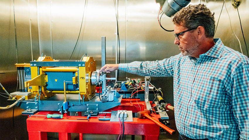 Hilbert showcases a piece of machinery